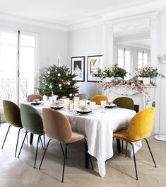 a dining room table set for christmas dinner