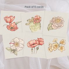 four cards with different flowers on them and the words pack of 6 cards written below