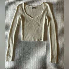 Cream Long Sleeve Top. Size X-Small. Great Condition- Never Worn. White Knit V-neck Crop Top, Trendy White Stretch Knit Top, Casual White Ribbed Knit Top, Trendy White V-neck Knit Top, Trendy Ribbed Cream Knit Top, White Ribbed V-neck Knit Top, Trendy Fitted Cream Knit Top, White Fitted Knit Top Casual, White Fitted Casual Knit Top