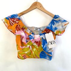 Super Cute And Colorful Is This Crop Top By Zara. Nwt Size Small. Elastic Shoulders And Back So It Stretches Some. Same Day Or Next Day Shipping. K Zara Multicolor Tops For Vacation, Multicolor Short Sleeve Crop Top For Beach, Casual Orange Crop Top For Vacation, Multicolor Floral Print Crop Top For Vacation, Multicolor Floral Print Crop Top For Summer, Zara Multicolor Tops For Day Out, Casual Multicolor Printed Crop Top, Orange Floral Print Tops For Beach Season, Multicolor Printed Summer Crop Top