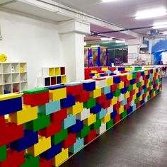 colorful lego blocks are lined up on the wall