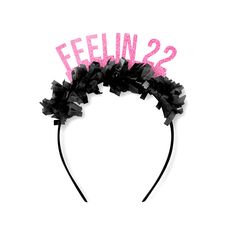 a black and pink headband with the words'feelin'2'written on it