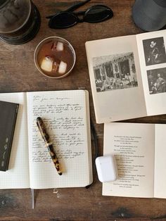 an open book sitting on top of a wooden table