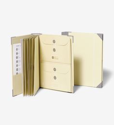 an opened file folder on a white background with clippings in the front and back