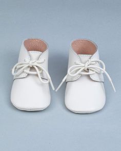 Our Sweet Little Baby Boy Crib Shoe. Your darling little boy will look absolutely adorable in our lace up oxford crib shoes. Made of supple leather exterior with a fine leather lining that feels soft on baby's foot. These shoes are the perfect dressing up style for a baptism, baby shower, birthday or any special occasion. Size Guideline:16 (0/3M)17 (3/6M)18 (6/9M)19 (9/12M)20 (12/18M) Cute Booties For Baptism, Cute Round Toe Booties For Baptism, White Lace-up Booties With Soft Sole, Baptism Booties With Soft Sole And Round Toe, Spring White Booties As Gift, Cute Leather Spring Booties, Lace-up Leather Shoes With Soft Sole, White Round Toe Booties For Formal Occasions, White Round Toe Formal Booties