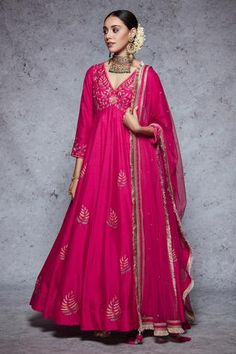 Rani pink anarkali highlighted with floral embroidery, V-neckline and gathers at the yoke. Comes with a churidar and a dupatta. - Aza Fashions Rani Pink Anarkali Suit, Mehendi Dresses, Angrakha Anarkali, Floral Anarkali, Anarkali Designs, Anarkali Churidar, Pink Anarkali, Rani Pink, Embroidered Anarkali