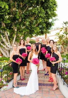 the bride and her bridal party are posing for a photo on their wedding day