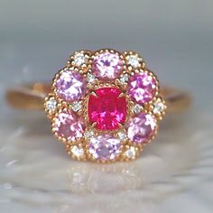 A beautiful and unique pink neon spinel ring, created in double halo hydrangea settings to create a luxurious and high-quality piece of jewelry, perfect to express your love. 💎 PREMIUM RING -- A brand new spinel ring, personally designed and made with the highest quality of 14K rose gold. It is designed ✨ CLASSIC BRILLIANCE -- Designed with a beautiful neon Jedi pink spinel at the center and chunky baby pink spinels for its side, producing a rich piece of jewelry with classic brilliance. ❇️ EXQ Fine Jewelry Pink Halo Ring With Accent Stones, Pink Diamond Ring With Halo Setting For Formal Events, Pink Diamond Ring With Halo Setting For Formal Occasions, Formal Pink Diamond Cluster Ring, Formal Pink Flower-shaped Rings, Pink Cluster Diamond Ring With Center Stone, Pink Halo Ring With Prong Setting For Formal Occasions, Luxury Pink Ruby Ring For Formal Occasions, Luxury Pink Halo Diamond Ring