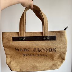 Brand New Nwot Combine To Save On Shipping $$ Purchased From Marc Jacobs In Nyc Has Been Stored In A Dust Bag. Inside Lining Is Waxed Making This A Perfect Bag For Keeping Drinks And Snacks Cold. Measurements Shown In Pics Comparable Mj Bags Shown With Pricing. This Bag Is A Great Deal. Take Advantage Of My Closet Clean Out And Enjoy!! Brown Straw Bag For The Beach, Beach Straw Bag With Top Handle And Dust Bag, Brown Straw Bag With Dust Bag For Everyday Use, Summer Travel Bag Made Of Burlap, Burlap Travel Bags For Summer, Summer Travel Burlap Bags, Burlap Tote Shoulder Bag For Travel, Brown Square Beach Shopping Bag, Jute Travel Pouch Bag