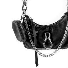 Features : - a weighty front facing industrial metal carabiner clip - a trio of safety pins - an adjustable and detachable strap - metal chain that doubles as a top handle - detachable airpod case / coin purse - rounded tip spiked bottom feet Edgy Shoulder Bag With Silver-tone Hardware, Edgy Shoulder Bag With Silver-tone Hardware For Everyday, Functional Shoulder Bag With Silver-tone Hardware, Functional Shoulder Bag With Silver-tone Hardware For Everyday Use, Chunky Silver Jewellery, Tech Essentials, Chain Of Command, Mini Convertible, Carabiner Clip