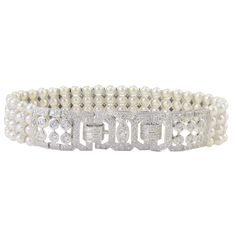 This exquisite estate bracelet features 3.50 CTW of diamonds and four strands of pearls. This 7 inch 18 karat white gold bracelet has round diamonds at approximately 3.50 carat total weight VS-SI clarity H-I color and four strands of natural Japanese pearls. This pearl and diamond bracelet is appraised at $11,300. Dimensions: 7″L x .62″H x .20″D at clasp SKU #ADTI 38 Diamond Bracelets Wedding, 1 Carat Diamond Ring, Japanese Pearls, Flexible Bracelet, Bracelet Wedding, Diamond Wedding Sets, Gold Armband, Diamond Bridal Sets, White Gold Bracelet