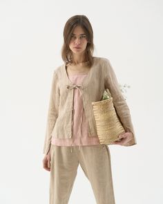 "This is a ready-to-ship item. All sizes and full color swatch available in regular selection. Light tie-string linen cardigan. Ideal for summer evenings. Offered in medium-weight and exclusive linen.  STYLE DETAILS  * Regular fit * Tie string front (2 ties) * Scoop neckline * Long sleeves * Back hem slightly longer than the front * Made from medium-weight and exclusive linen SIZES & COLORS IN THE PICTURES * Model is wearing S in Beige (medium) linen Model's height - 175 cm (5'9\"), bust 80 cm (31.5\"), waist 59 cm (23.2\"), hips 89 cm (35\"). NOTES ON SIZING AND COLOR * You can find Size Guide and Color Card among the pictures * All of our garments are double washed for extra softness and shrinkage prevention. This means that the garment will not shrink any further. * Please note that lin Luxury Business Linen Outerwear, Luxury Linen Spring Outerwear, Casual Linen Spring Cardigan, Casual Linen Cardigan For Spring, Beige Linen Casual Cardigan, Casual Beige Linen Cardigan, Linen Cardigan Outfit, Beige Linen Cardigan For Spring, Beige Linen Spring Cardigan