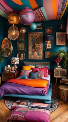 a bedroom with colorful bedding and pictures on the wall