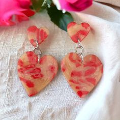 Red abstract print ceramic clay double heart earrings. Glossy finish. Hypoallergenic. Top heart is approximately 10mm and bottom heart is approximately 25mm. Hypoallergenic. Handmade. If you would like more please contact me  All my items are handmade with quality materials. If you do have a problem with your order or if you have any questions please contact me in the link provided. I strive to make all my customers happy Heart-shaped Polymer Clay Earrings For Valentine's Day, Artsy Heart-shaped Earrings For Gifts, Valentine's Day Heart-shaped Polymer Clay Earrings, Hand Painted Heart Earrings For Valentine's Day Gift, Heart-shaped Polymer Clay Earrings For Gifts, Polymer Clay Heart Earrings As Gift, Red Heart-shaped Hand Painted Jewelry, Double Heart Earrings With Heart Print, Heart Abstract