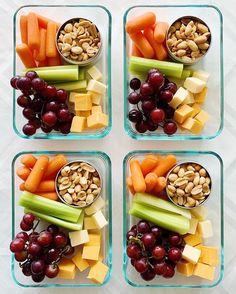 four glass containers filled with assorted fruits and vegetables