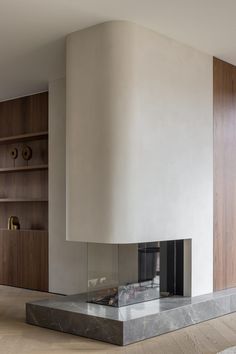 a modern fireplace in the middle of a living room