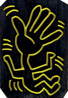 a black and yellow sign with an image of a hand