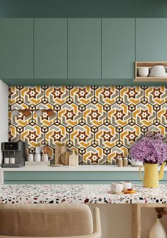 a kitchen with green walls and patterned tile backsplash, yellow vases on the counter