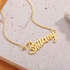 Show your name off with pride with our Cursive Name Necklace in 18k gold, Rose Gold or Sterling Silver. We are happy to provide you a personalized necklace you can treasure forever. Customize me! With up to 12 characters to choose from, please be sure to double check your spelling and formatting before submitting an order! By default the first letter is capital. Material : 925 Sterling Silver Finish : 18k Gold - Rose Gold Personalized Pendant Name Necklace, Elegant Customizable Charm Necklaces For Birthday Gift, Customized Rose Gold Necklace For Personalized Gift, Rose Gold Name Necklaces, Rose Gold Name Necklaces For Valentine's Day, Rose Gold Name Necklace For Valentine's Day, Rose Gold Necklaces With Name For Valentine's Day, Customized Yellow Gold Charm Necklaces For Personalized Gifts, Customized Gold Plated Jewelry For Personalized Gift