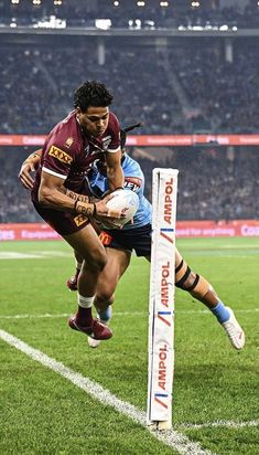 a rugby player dives for the ball during a game