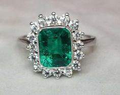 Gorgeous 14K WHITE GOLD ring Gem GREEN Colombia emerald. Center set Gem lab flux growth green Colombia emerald in emerald shape weight 1.75ct. size 8.5x7mm very nice rich vivid green color nice luster, lively ,nice cut,Sparkly emerald. side set 16 natural round diamonds total weight 0.64ct. H-VS Ring size 7.5 Retail Value $6,500 net Appraisal available Vintage Platinum Rings, Platinum Ring, 14k White Gold Ring, White Gold Ring, Natural Aquamarine, Green Emerald, Gold Engagement, Ring Size 7, White Gold Rings