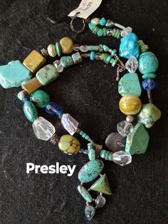 "Presley " I make my jewelry with the picky fashion diva in mind.  She never wears ordinary and her sassy attitude rules her jewelry box. Unique custom necklace. The one of a kind pendant includes turquoise, topaz and moonstone. It is complimented by a array of turquoise , green coral,moonstone, tumbled stone  and  Bali silver.  Let my jewelry call your name. Obsidian custom gemstone pendant  Toggle closure.  The necklace measures 21". Fast Free Shipping Item #505 Turquoise Beaded Fusion Jewelry, Unique Turquoise Jewelry With Gemstone Beads, Beaded Apatite Round Beads Jewelry, Unique Hand-strung Turquoise Beaded Necklace, Artisan Turquoise Beaded Necklaces With Stones, Artisan Turquoise Beaded Necklace With Gemstone, Unique Hand-strung Turquoise Jewelry, Turquoise Apatite Gemstone Beaded Necklaces, Turquoise Apatite Beaded Necklace