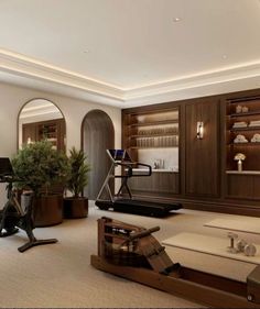 a living room filled with lots of furniture next to a tall wooden shelf full of books