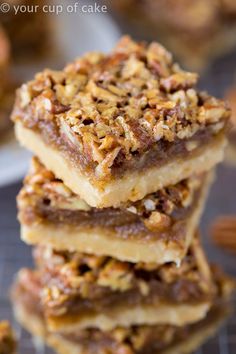 three pieces of pecan bar stacked on top of each other