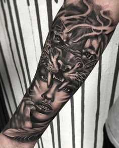 a man's arm with a tiger and woman on it