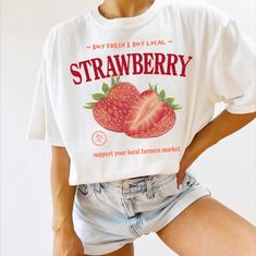 Made-to-order "Farmers Market Strawberry" tee shirt! Printed on a Comfort Colors garment-dyed t-shirt. If you enjoy this product, I would love you to leave a review! ✿  HOW TO ORDER ✿ 1. Choose the shirt color from the 1st dropdown. 2. Choose the shirt size from the 2nd dropdown. 3. Add each item to the cart.  ✿  Sizing & Fabric ✿ These shirts are unisex, meaning they tend to run wider/longer than women's styles might. The soft-washed, garment-dyed fabric brings extra coziness to your wardrobe, Strawberry Sweater, Strawberry T Shirt, Aesthetic Strawberry, Granola Aesthetic, Strawberry Shirt, Comfort Colors Tshirt, Vegan Shirt, Granola Girl, Dyed Fabric