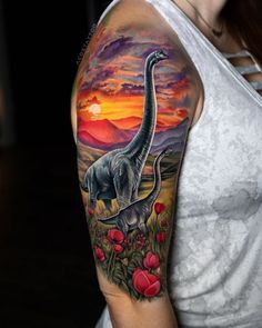 a woman with a tattoo on her arm and an image of a dinosaur in the background