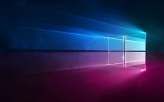 the windows 10 wallpaper has been changed to be blue and pink, with light coming through it