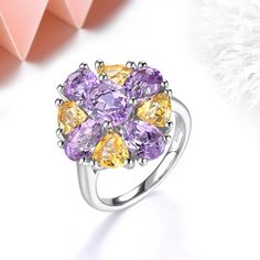 Vintage Multicolor Pink Amethyst and Citrine Sterling Silver Ring This stunning ring boasts a vintage design and classic style, crafted from luxurious sterling silver. With 5.5 carats of genuine multicolor gemstones, including natural pink amethyst and citrine, this ring is truly one-of-a-kind. Unique Features Metal: 925 Sterling Silver Main Stone: Natural Pink Amethyst Main Stone Size: Oval 8mm x 6mm Side Stone: Natural Citrine Side Stone Size: Trillion 5mm x 5mm Total Stone Weight: Approx. 5.5 Luxury Multicolor Amethyst Gemstone Ring, Amethyst And Citrine, Silver Ring For Women, Ring Flower, Yellow Citrine, Wedding Band Sets, Pink Amethyst, Ring Oval, Silver Pieces