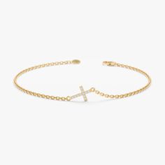 Natural Diamond Cross Bracelet: This 14k gold bracelet features a dainty sideways cross adorned with sparkling diamonds (0.3 ctw, G color, SI clarity), available in yellow, rose, or white gold. Perfect Gift for Her: Ideal for expressing faith, this elegant and stackable bracelet adds a touch of sophistication and spirituality to any outfit. High-Quality Craftsmanship: Made with solid 14k gold and securely set natural diamonds, ensuring lasting beauty and durability. Versatile and Stylish: The timeless design and 5 x 7 mm cross make it suitable for everyday wear and special occasions, offering a chic and meaningful accessory. * SKU- SABR 545 𝐑𝐞𝐭𝐮𝐫𝐧 𝐏𝐨𝐥𝐢𝐜𝐲 100% Satisfaction Guaranteed & Hassle-Free Return. You will get 𝐟𝐮𝐥𝐥 𝐫𝐞𝐟𝐮𝐧𝐝 or 𝐞𝐱𝐜𝐡𝐚𝐧𝐠𝐞 within 𝟑𝟎 𝐝𝐚𝐲? Gold Cross Bracelet, 1st Communion, Gold Armband, Diamond Choker, Dope Jewelry, Beautiful Gift Wrapping, Accessories Ideas, Diamond Cross, Jewelry Lookbook