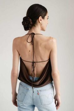 The odette silk satin draped backless top in cocoa is luxuriously draped on the bias from our signature silk charmeuse. pair it with your favorite trousers for an elevated night out look or dress it down with your favorite pair of jeans. scroll through to see the 4 different ways you can tie the straps to change up the look from delicately tied at the shoulders to almost fully backless when tied under the arms (shown in the color french rose).    care & info    - dry clean only  - 100% silk  - fully lined in silk  - bias cut    sizing notes    - true to size take your usual size.  - krysta is wearing size xs. she is 5’9” (180 cm) Emerald Dress, Skirt Ideas, Emerald Dresses, Rose Care, Summer Shades, French Rose, Draped Top, Strappy Top, Backless Top