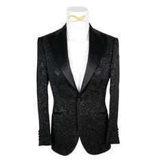 Black Designer Fiore Fabric Woven In France Satin Signature Peak Lapel Single Button Closure Soft, natural shoulder construction Chest Barchetta Pocket Dual Vents Satin covered buttons Handmade in any size! Includes a Sebastian Cruz Couture Pocket Square of your choice! All of our jackets are made with 4" extra of fabric to ensure you don't have to send it back to us if its too small or too big. You can tailor your jacket 2 sizes bigger and/or smaller if needed. We guarantee your satisfaction! F Luxury Tuxedo With Button Closure For Formal Events, Luxury Tuxedo With Button Closure For Formal Occasions, Luxury Formal Tuxedo With Button Closure, Luxury Tailored Tuxedo With Buttons, Luxury Fitted Suits With Button Closure, Fitted Tuxedo With Button Closure For Formal Events, Fitted Formal Tuxedo With Button Closure, Fitted Tuxedo With Button Closure For Formal Occasions, Evening Tailored Blazer With Covered Buttons