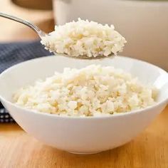 rice in a white bowl with a spoon