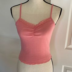 Cute Coral Pink Cami Tank Top. Cropped Length And Feminine Pointelle Texture. Lace Trim And A Gather On The Front. Adjustable Spaghetti Straps. New With Tags. Perfect With A Pair Of Wide Leg Jeans! Also Available In Teal And Coral Floral Print In My Closet. Trendy Camisole With Built-in Bra For Spring, Spring Lace Trim Camisole, Trendy Lace Trim Camisole For Spring, Pink Camisole For Spring Brunch, Pink Camisole For Brunch In Spring, Feminine Spring Seamless Tank Top, Feminine Seamless Tank Top For Spring, Feminine Seamless Spring Tank Top, Fitted Top With Delicate Straps For Day Out