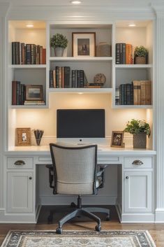 a home office with built in bookshelves and desk