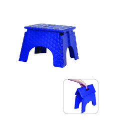 a small blue stool with one foot on it's side and another hand reaching for the top