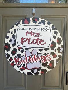 a sign that says composition book, mrs pute buddy's on the front door