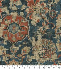 an old rug with many different colors and designs on the carpet, including red, blue,