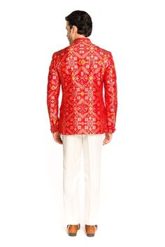 Red bandhgala featuring patola pattern all over. Paired with a solid pant. - Aza Fashions Red Nehru Jacket For Diwali Designer Wear, Designer Red Fitted Nehru Jacket, Red Fitted Nehru Jacket For Designer Wear, Festive Designer Bandhgala With Traditional Patterns, Festive Sherwani With Bandhani Print, Festive Traditional Fit Bandhgala For Festivals, Festive Traditional Bandhgala For Festivals, Designer Motif Fitted Sets, Designer Fitted Sets With Motifs