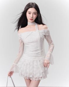 This elegant white lace one-shoulder crop top and skirt set features delicate lace detailing and a flattering one-shoulder design. Perfect for any occasion, this set exudes sophisticated charm and showcases your unique sense of style. Elevate your wardrobe with this must-have ensemble. ■ Model Info Height: 169 cm Weight: 47 kg Wearing Size: M White Off-shoulder Lace Dress, White Off-shoulder Lace Dress For Party, Off-shoulder Lace Tops For Party, Fitted Off-shoulder Lace Top For Party, Fitted Off-shoulder Lace Dress, Chic Off-shoulder Lace Top, Chic Off-shoulder Lace Dress With Lace Trim, Spring Party Off-shoulder Lace Top, Tiered Mini Skirt