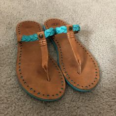 Ugg Flip Flops With Turquoise Details! Never Worn Outside, In Like-New Condition. Perfect For The Summer And Beach! Casual Blue Flip Flops, Blue Leather Casual Flip Flops, Casual Blue Leather Flip Flops, Casual Flat Turquoise Sandals, Casual Turquoise Flat Sandals, Casual Turquoise Open Toe Sandals, Casual Turquoise Slip-on Sandals, Ugg Flip Flops, Ugg Slides