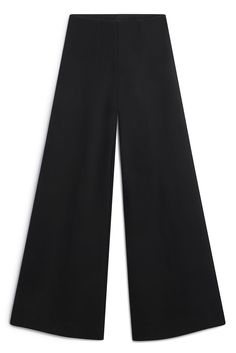 This ultra-wide pant is a statement maker in four-way stretch ponte. Style it with a tucked-in tee for a casual look or dress it up with a blazer for a power suit. ✓ Wrinkle Free ✓ Four-Way Stretch ✓ Day to Night ✓ Pocket DETAILS Luxe ponte knit Elasticated pull-on waistband No-Bulk back pocket FIT Wide leg Regular waist fit True to size Model is 5'8" and wears size S MEASUREMENTS Inseam: 32.5" Front rise: 11.5" (size S) Leg opening circumference: 29" (size S) FABRIC + CARE 67% rayon, 30% nylon, 3% Spandex Dry clean only. Ultra Wide, Power Suit, Travel Wardrobe, England Travel, Black Xs, Wide Pants, Wrinkle Free, Pocket Detail, Women's Pants