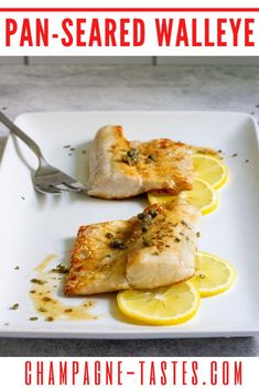 two pieces of fish on a plate with lemon slices