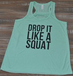 a tank top that says drop it like a squat