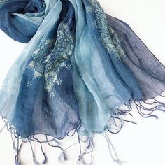 100% linen scarf in natural colors is perfect for all seasons - cool in summer and comfortable in the fall. It's lightweight, soft, and has a beautiful pattern with delicate twisted tassel ends. -100% light weight linen - Hand died, color and pattern may vary slightly -Rectangle: 185*60cm/73*24 inch without tassels -Three color/patterns: * Blue totem * Blue flax flowers * Blue Dots in frame Care: Hand wash in 80F/30C degrees water. Dry flat. Linen softens with washing. Don't dry clean. Don't tum Bohemian Blue Scarf With Natural Dye, Blue Bohemian Scarf With Natural Dye, Bohemian Linen Scarves For Spring, Bohemian Linen Shawl Scarf, Bohemian Linen Shawl, White Camisole Top, Linen Camisole, Linen Shawl, Top Knot Hairstyles