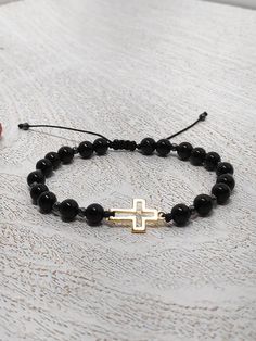 Adjustable women's bracelet featuring natural black onyx 6 mm beads, hematite Faceted beads, stainless steel gold filled  cross, protection bracelet, gift idea. To order right size just measure your wrist and select the length from the dropdown menu.  The option Size of wrist 15,5cm/6inch fits for wrist 15,5 and more. Option 18cm /7inches will have more beads and  fits for 18cm wrist and bigger. We can customize this to any length, please just  contact me. When it comes to emotional healing, Bla Adjustable Black Beaded Bracelets With Polished Beads, Black Gemstone Beads Rosary Bracelet Gift, Black Rosary Bracelet With Gemstone Beads As Gift, Adjustable Black Rosary Bracelet With Gemstone Beads, Black Beaded Rosary Bracelet As Gift, Black Hand-strung Rosary Bracelet As Gift, Adjustable Black Beaded Rosary Bracelet, Black Hematite Crystal Bracelet For Spiritual Use, Black Hematite Crystal Bracelet Spiritual